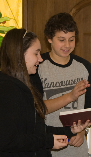 Confirmation students studying the bible