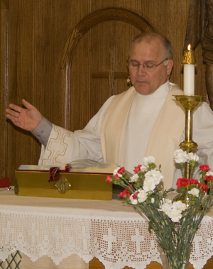 Our pastor, Rev Becker delivers a Sunday blessing.