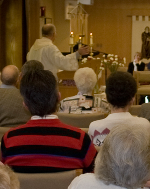 Our pastor, Rev Becker delivers a Sunday sermon to the congregation.